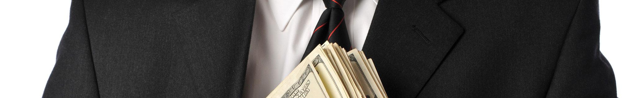 misappropriations - man in suit holding cash